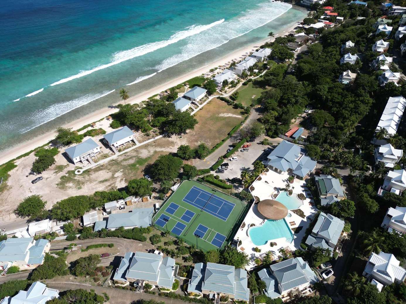 Beachfront retreat with tennis courts and sparkling pools