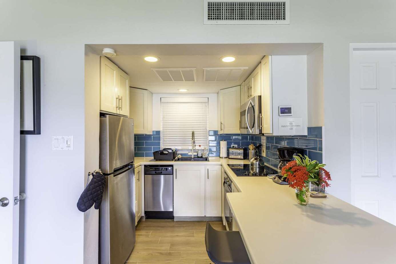 Bright, modern kitchen with sleek appliances and cozy dining nook