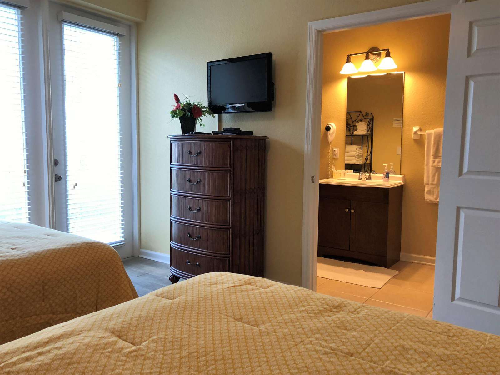 Flat screen TV and DVD player; en-suite bathroom first floor in background