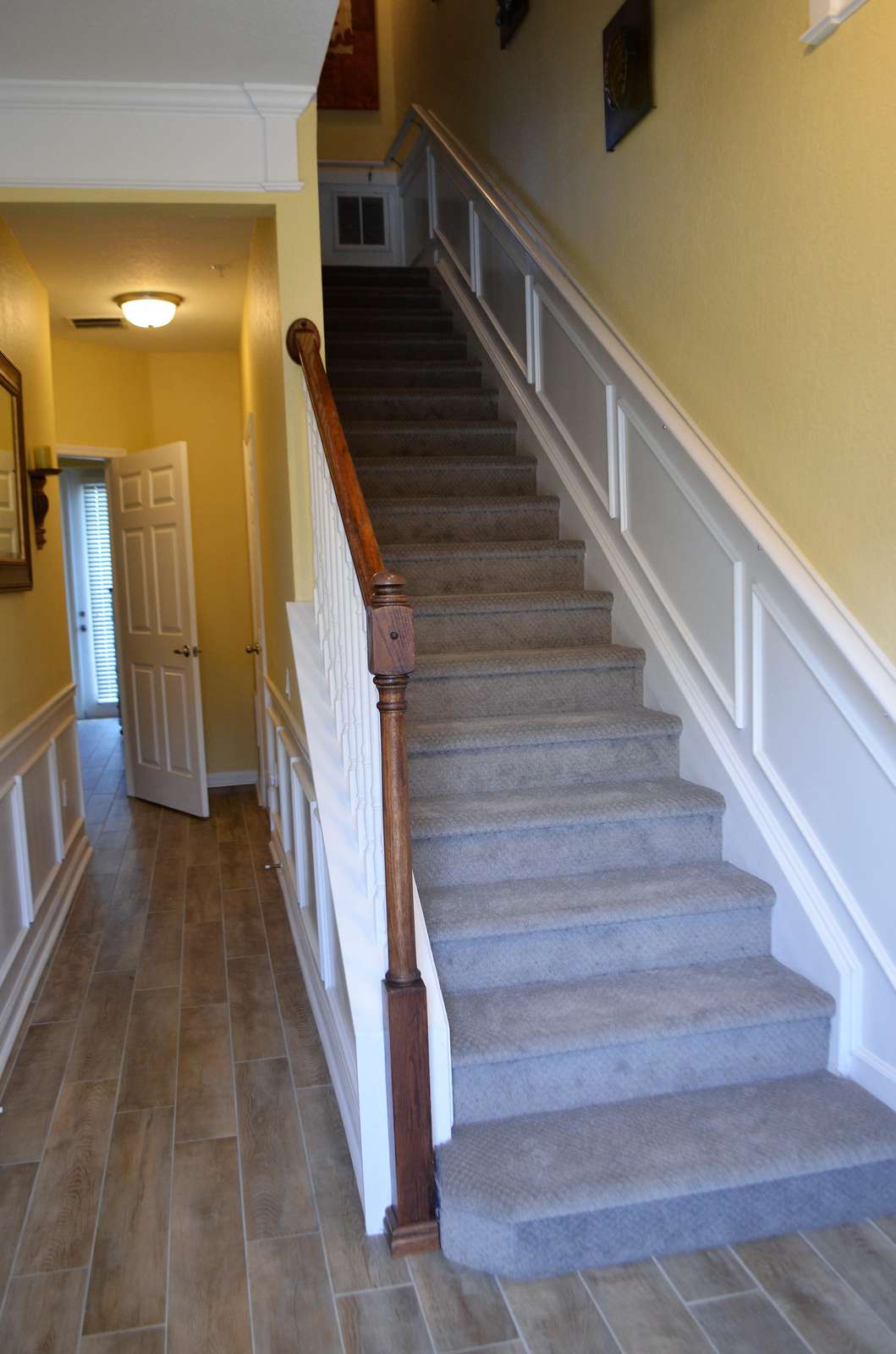 Hallway in first floor - bedroom to the left; living room, dining room and kitchen upstairs on second floor