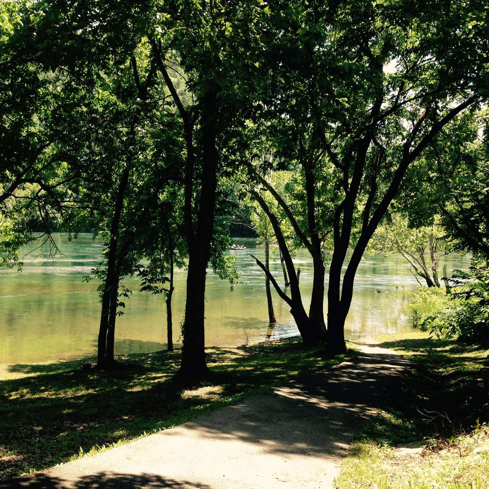 Walking path to water is behind playground