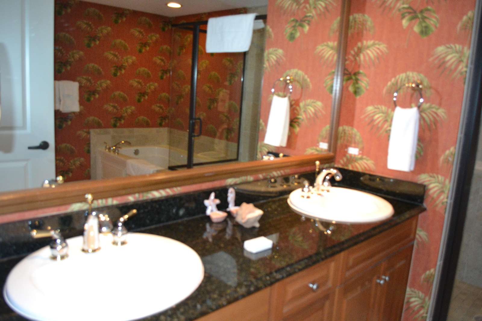 Master bath with double sinks, ceramic tiled, walk in shower and whirl pool tub