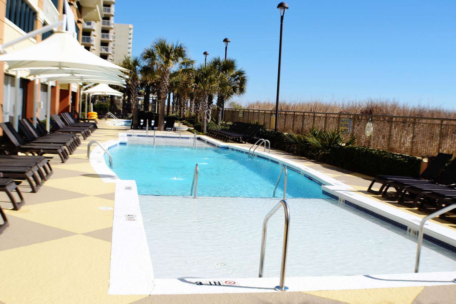 Outdoor pool with dual shallow ends