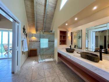 Spacious bathroom retreat with modern double vanity and natural light