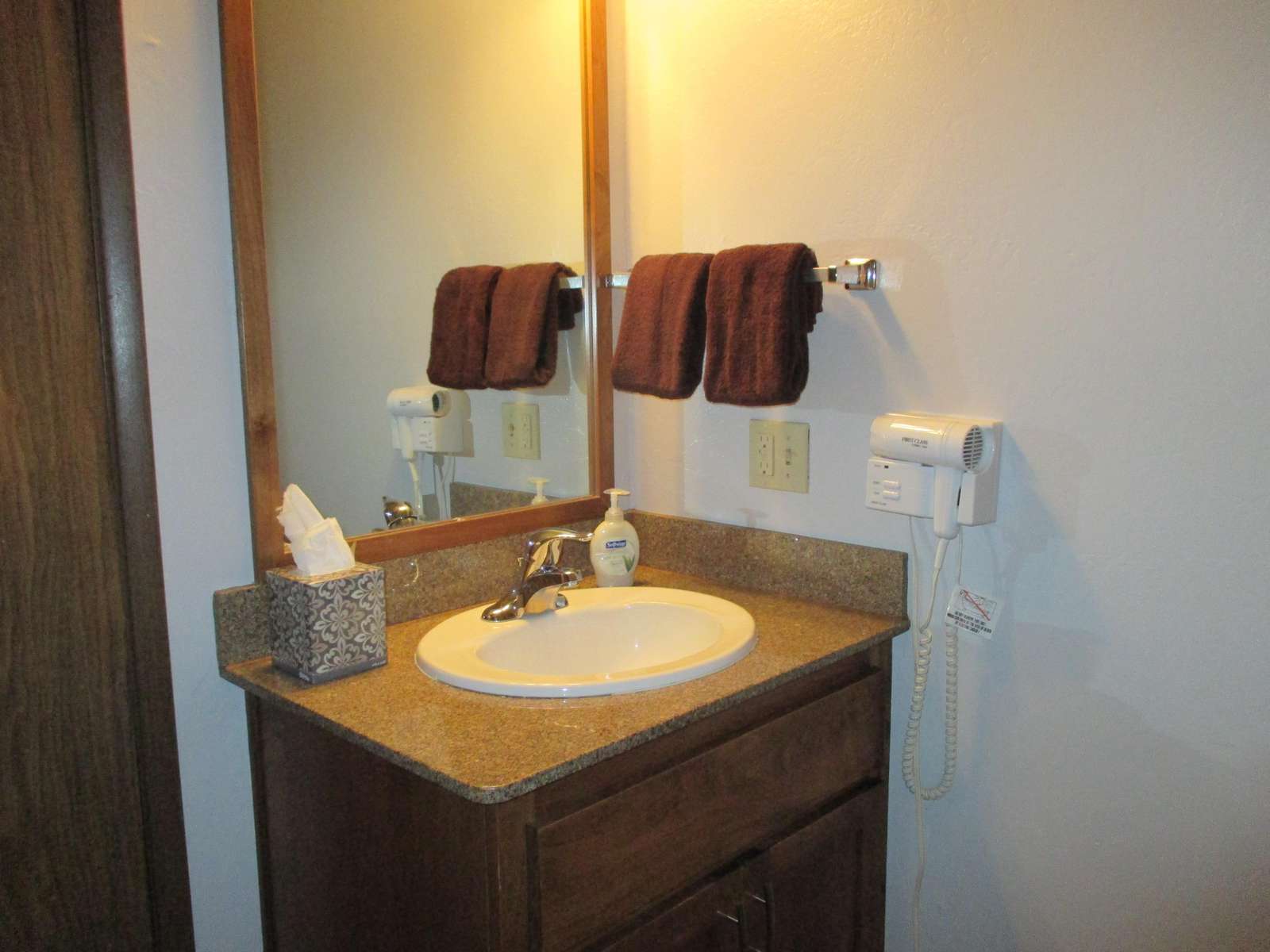 Loft has a vanity and sink adjacent to the bathroom.