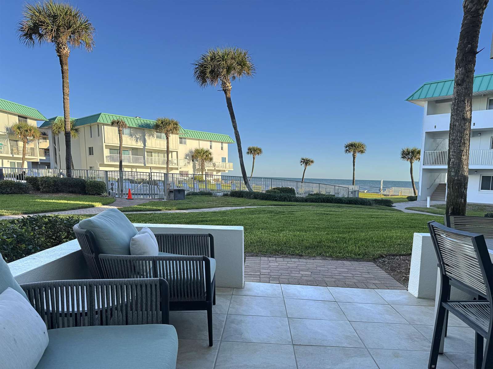 Relax on the spacious patio with stunning ocean views - property
