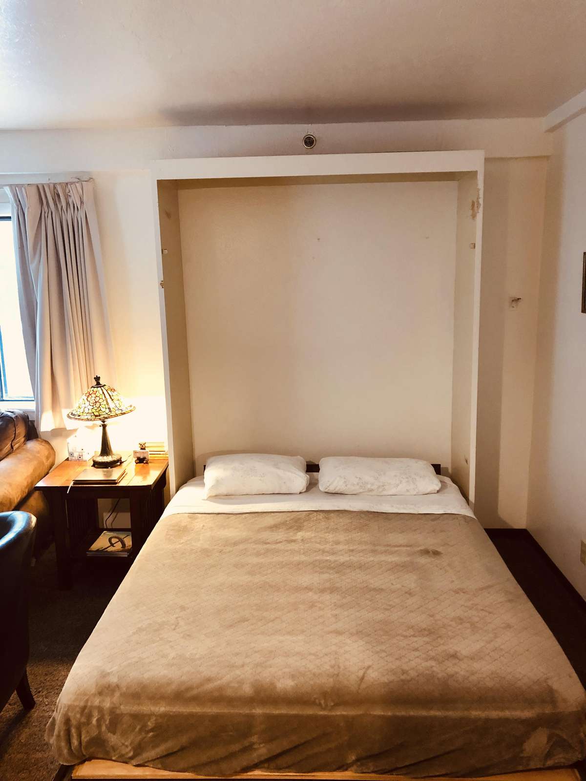 Your queen size Murphy bed folds down from the wall.