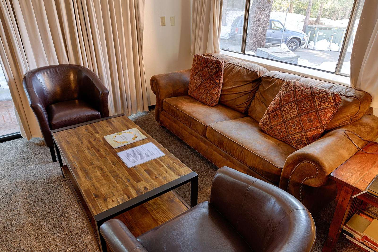 Your living area with queen size sofa sleeper, gas fireplace, TV & DVD player, dining area.