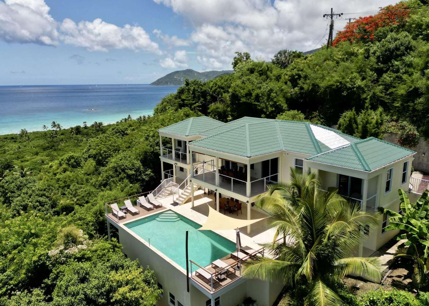 Ocean-view villa with private pool and lush surroundings