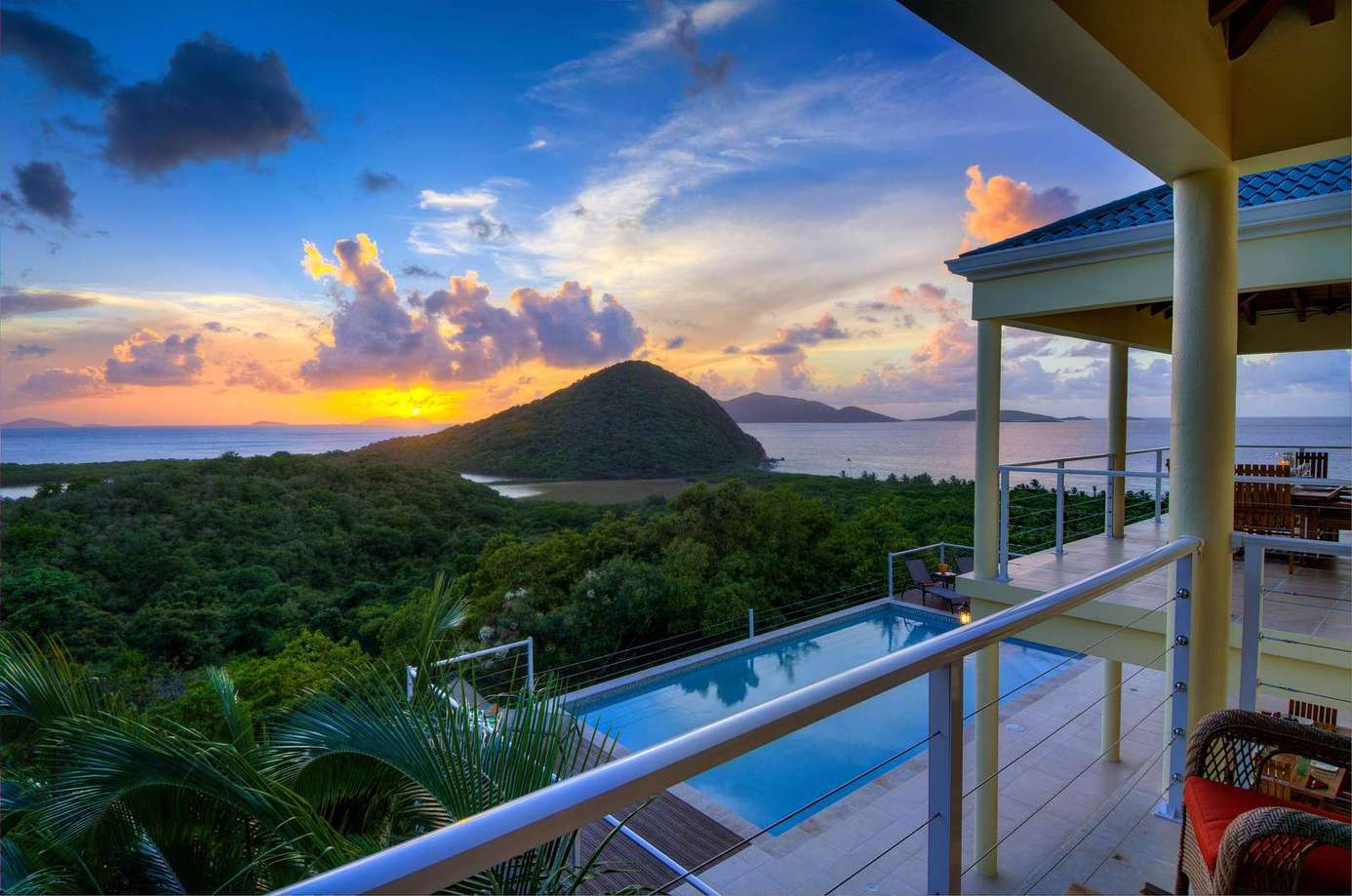 Sunset views from the spacious balcony with pool below