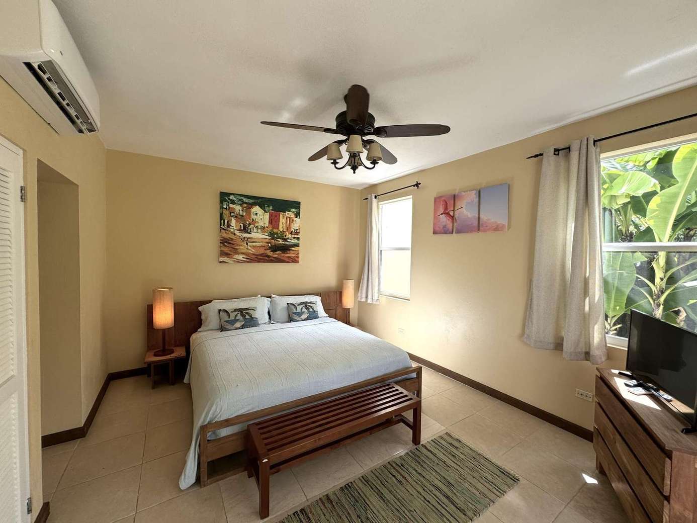 Cozy bedroom retreat with tropical garden views and natural light