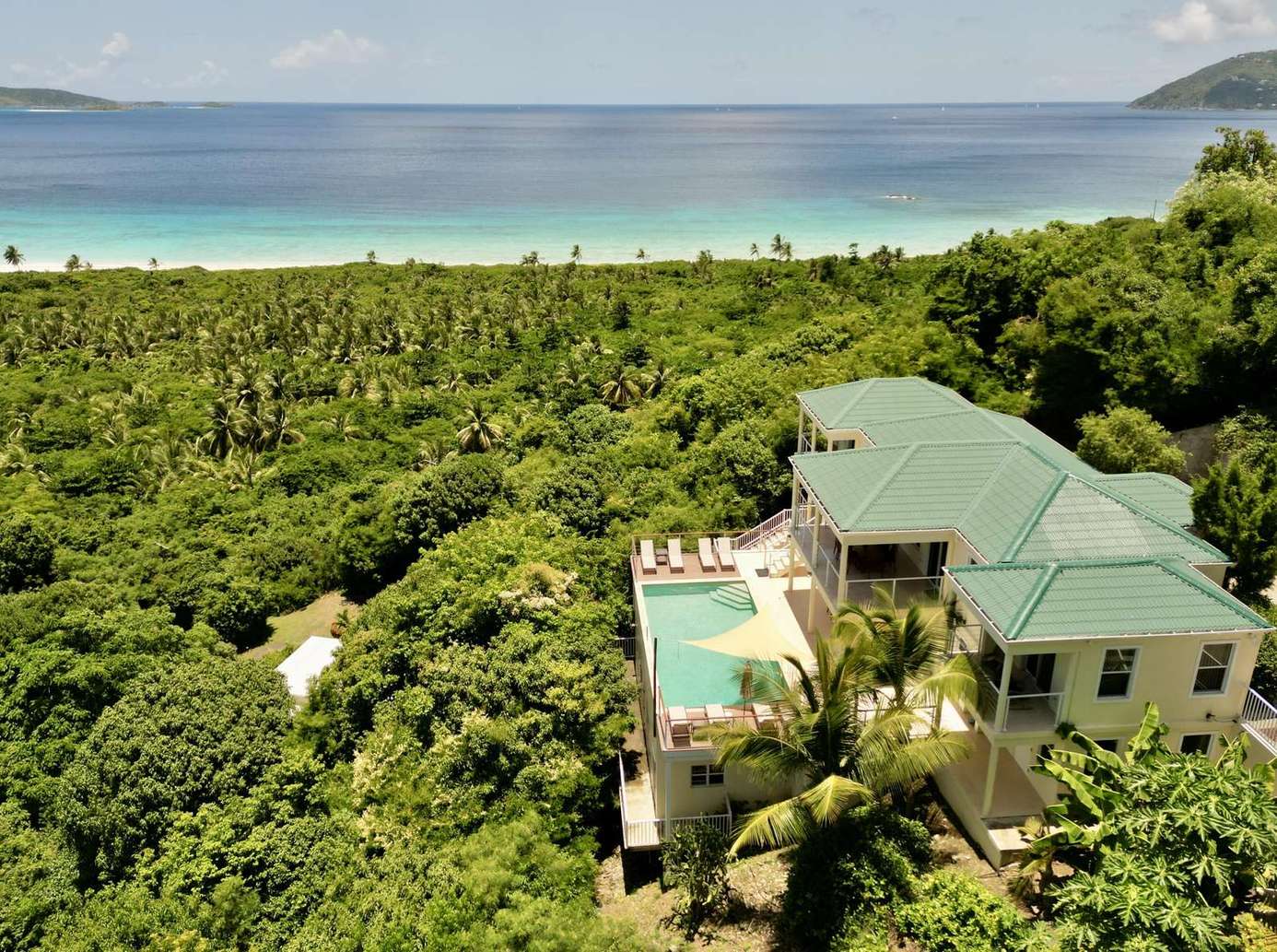 Secluded villa with lush greenery and ocean views