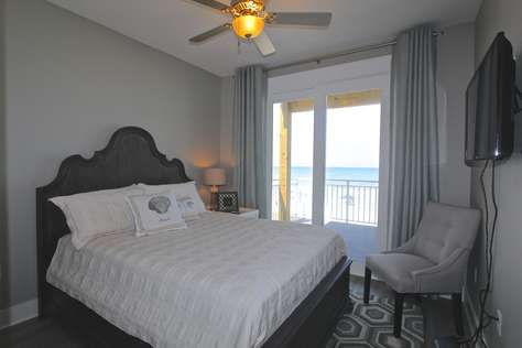 Bedroom #1 with queen bed (private bathroom, deck access and water view)