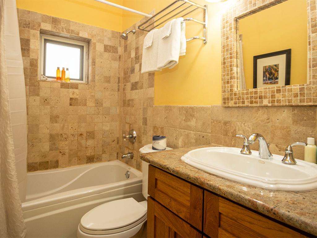 Cozy bathroom retreat with warm stone tile accents