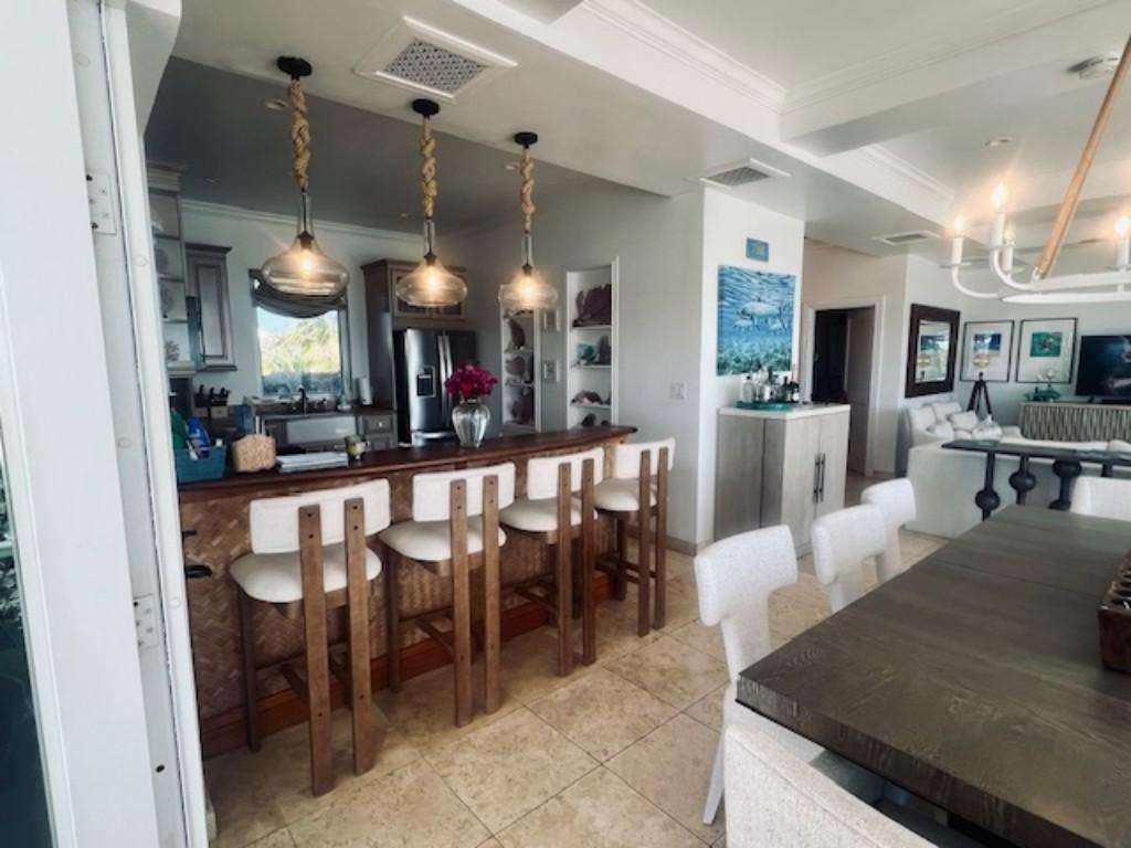 Spacious kitchen and dining area with modern island seating