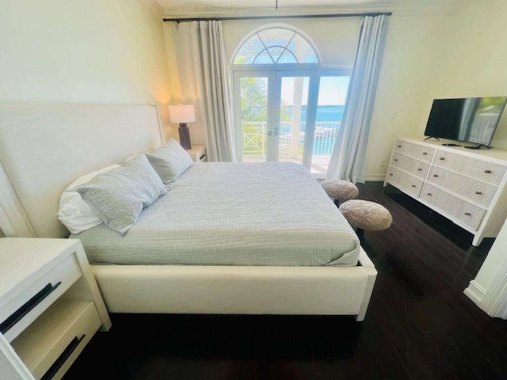 Bright bedroom with ocean views and cozy ambiance