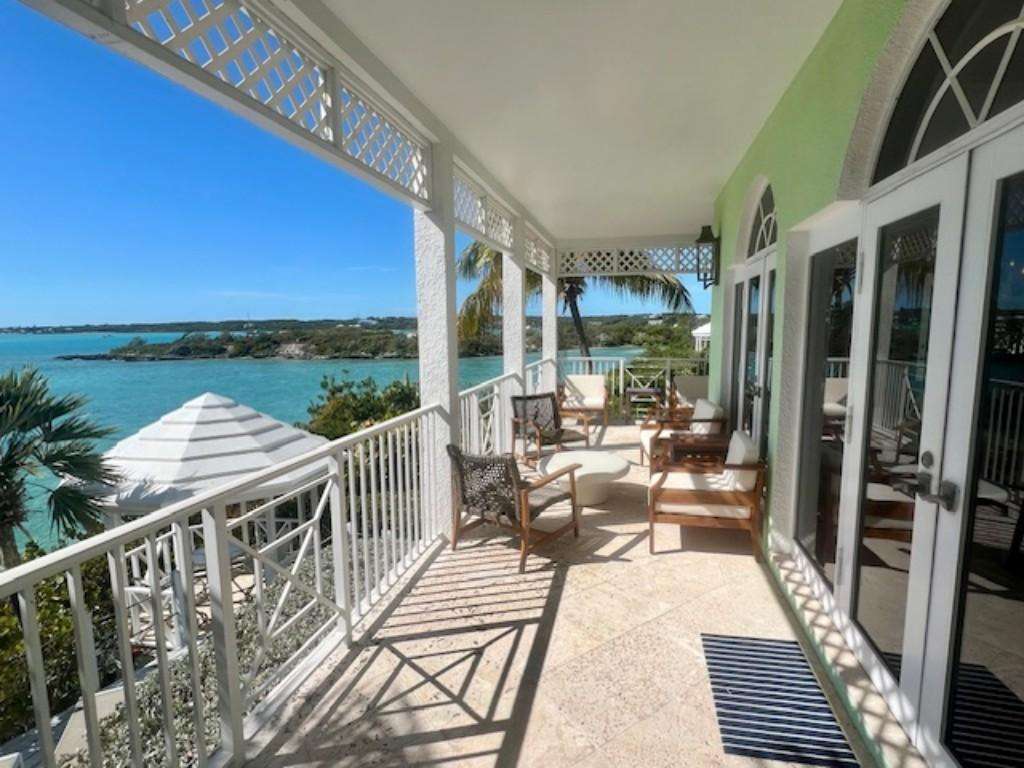 Spacious balcony with stunning waterfront views and cozy seating
