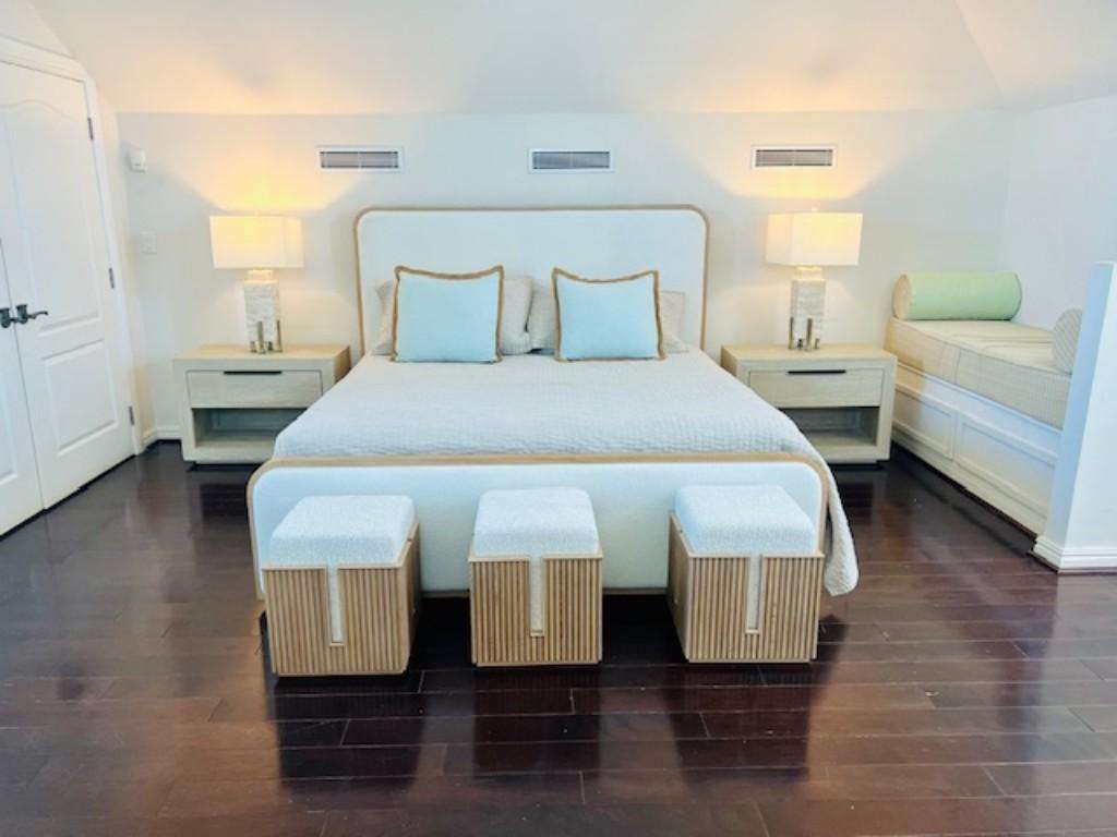 Bright and airy bedroom with cozy seating nook and modern accents