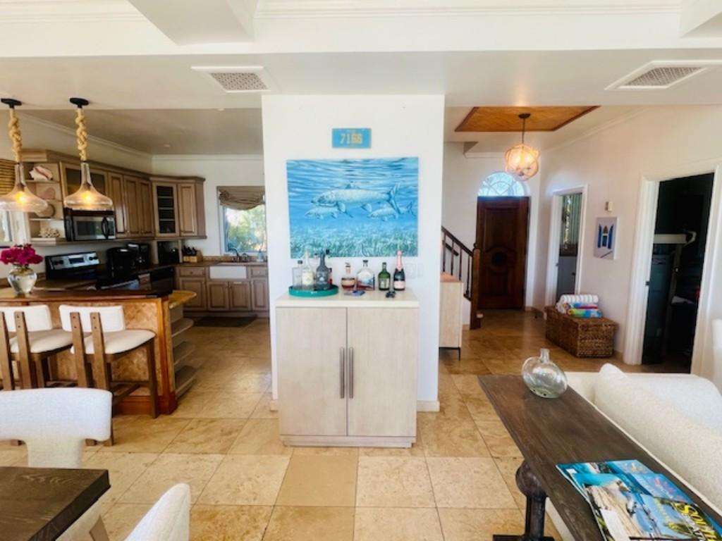 Spacious open-concept living and kitchen area with coastal charm