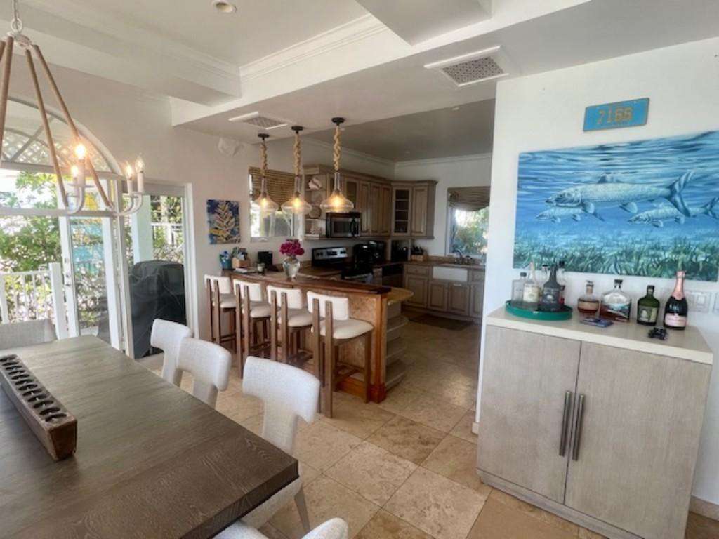 Bright open dining and kitchen area with coastal charm