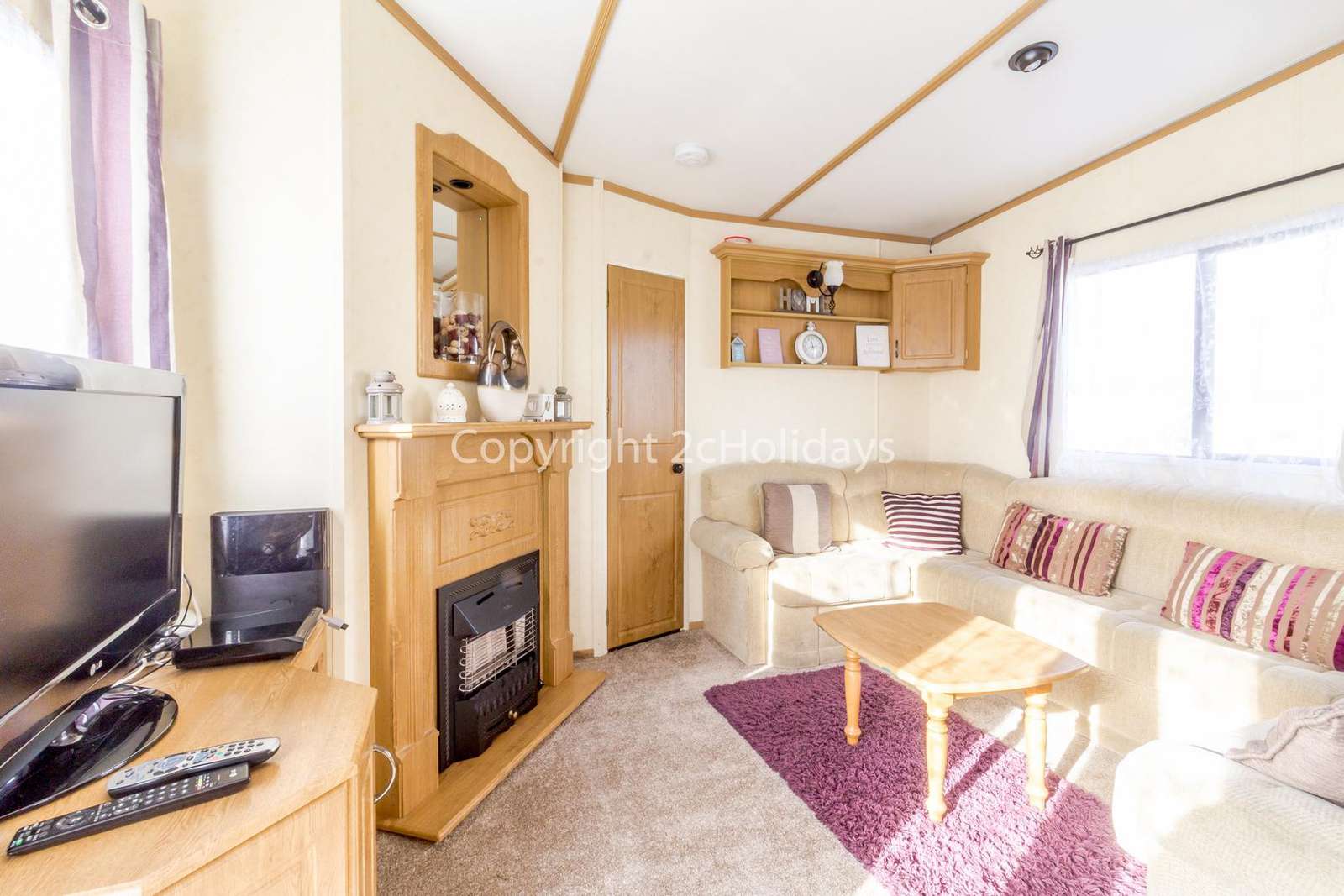 Lovely fireplace and a large flatscreen TV with a sky box!