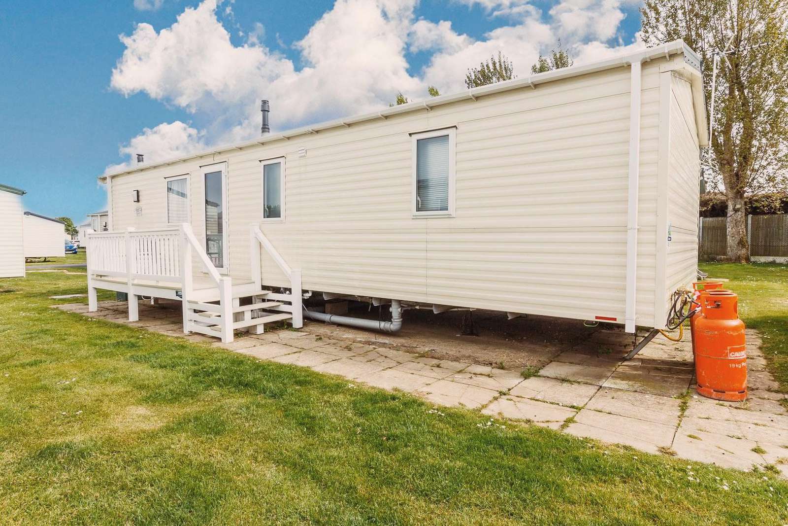 Caravan for hire with decking at Hopton Holiday Village