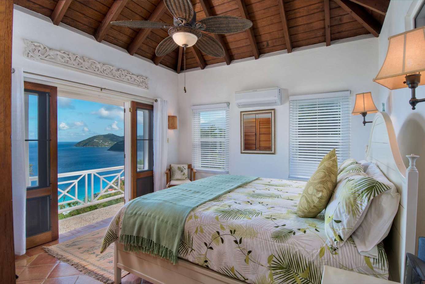 Serene bedroom with ocean views and tropical breeze