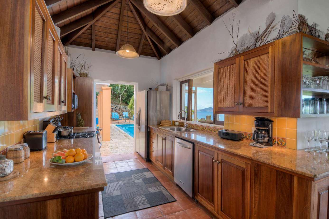 Spacious kitchen with warm wood tones and garden views