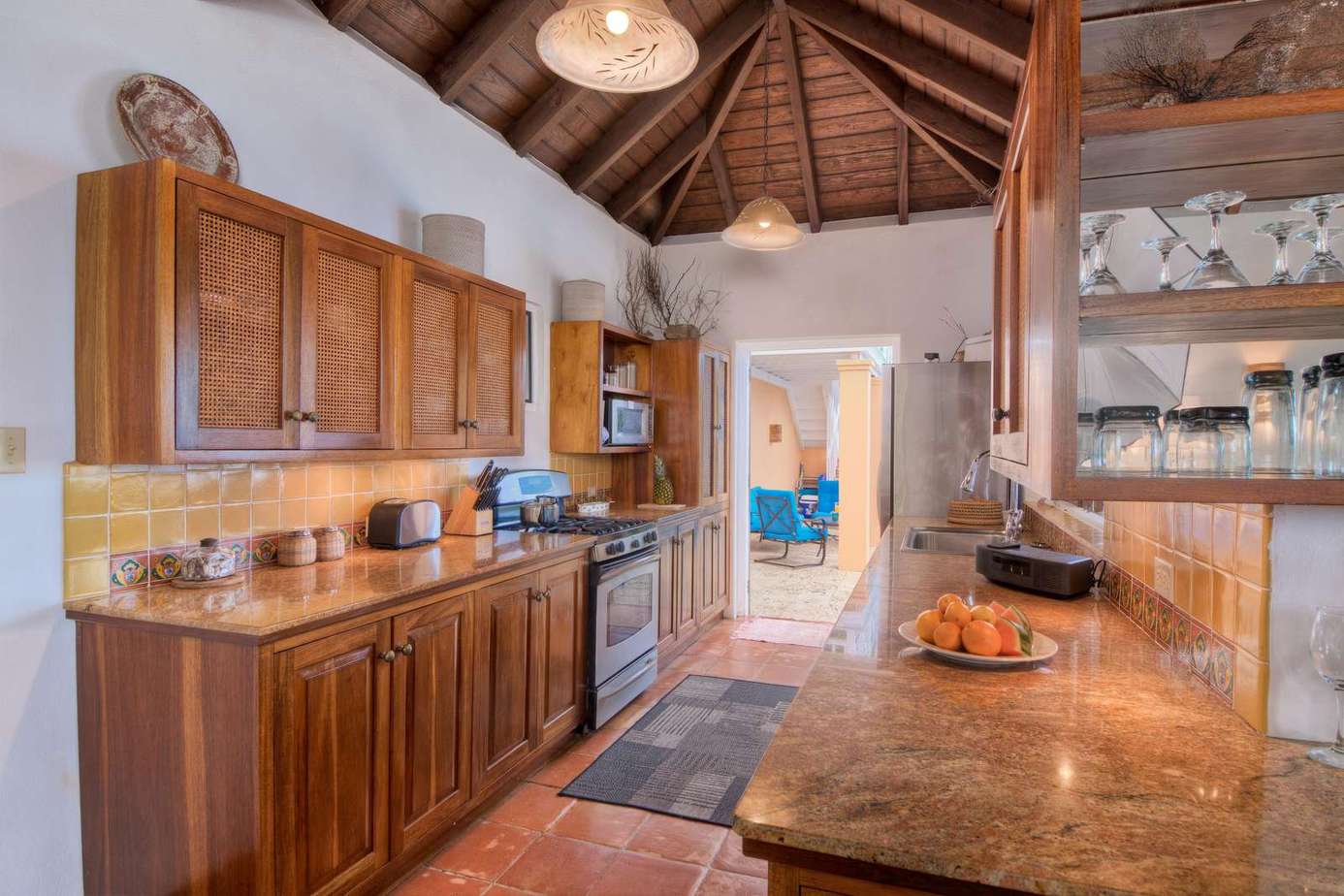 Spacious kitchen with warm wood accents and vaulted ceiling