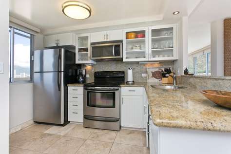 Modern Stainless appliances and all cooking utensils