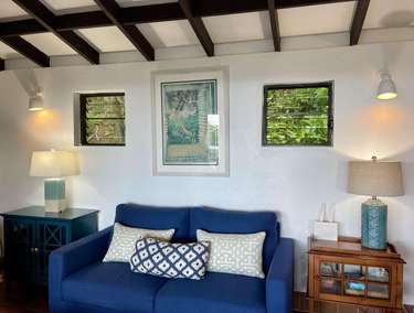 Cozy living room with vaulted ceilings and natural light