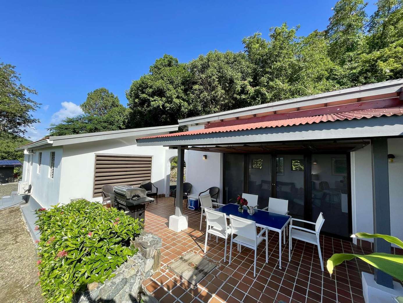 Sunny patio with ample seating for outdoor dining and relaxation