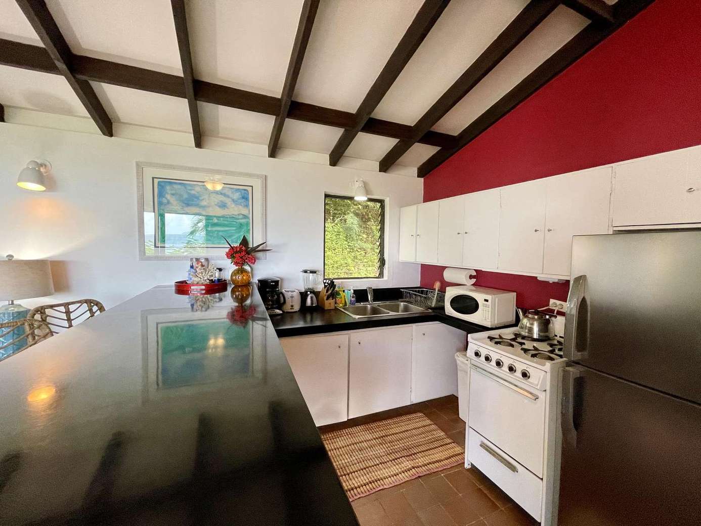 Charming kitchen with vaulted ceilings and cozy vintage stove
