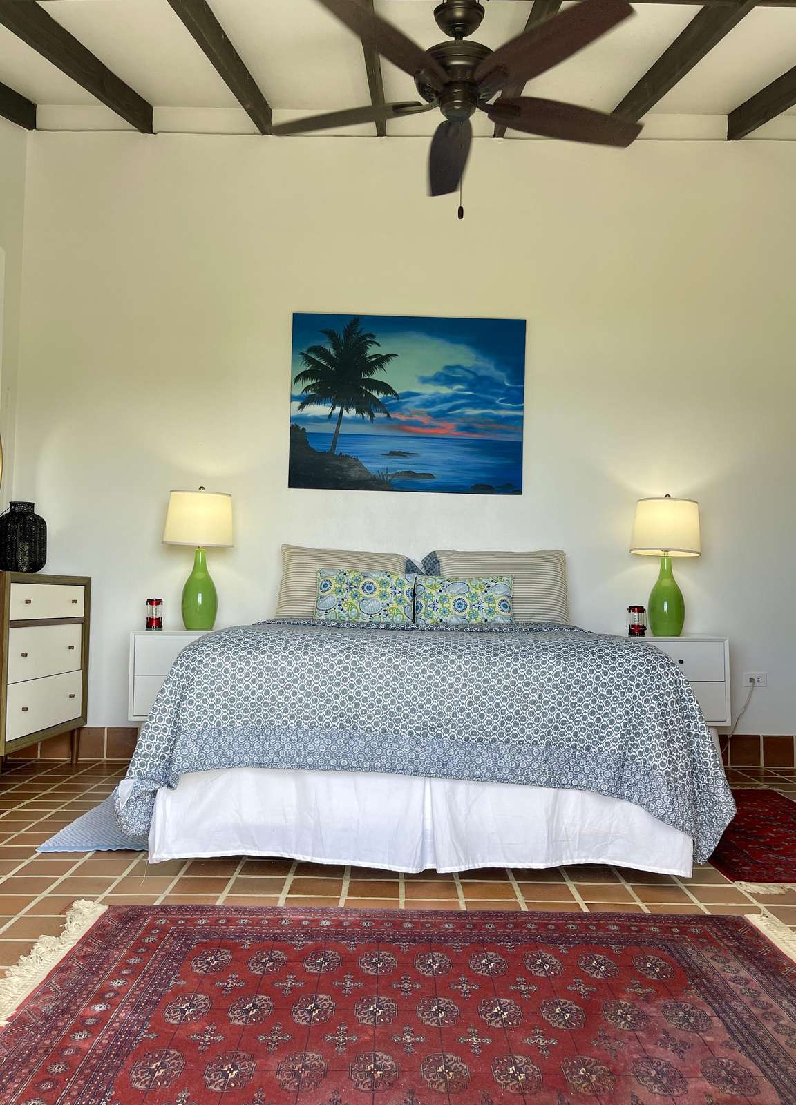 Cozy bedroom with vaulted ceilings and serene artwork