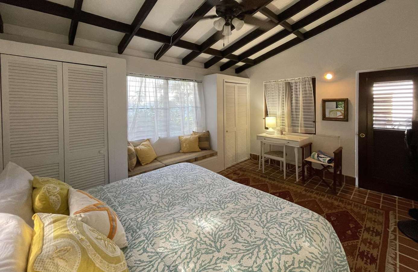 Cozy bedroom retreat with rustic beams and natural light