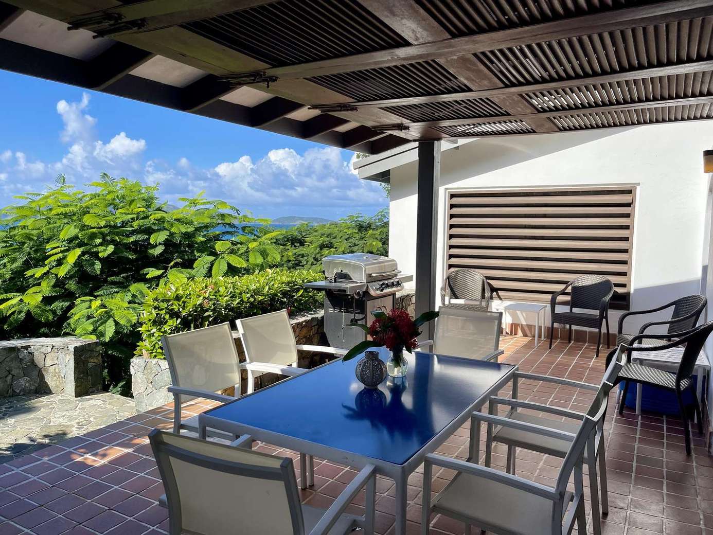 Spacious covered patio with scenic views and cozy seating