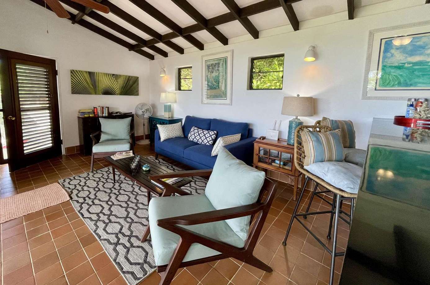 Cozy living room with vaulted ceilings and vibrant art