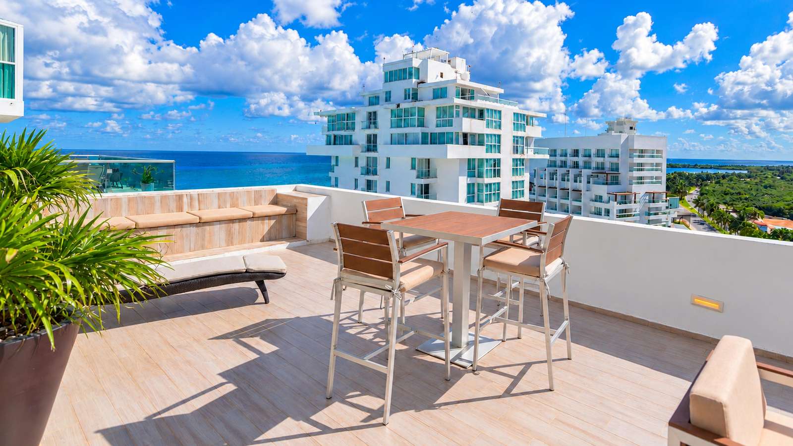 Penthouse 2704 private terrace with outdoor dining and Caribbean Sea views at Tim’s Ocean Condos. - property