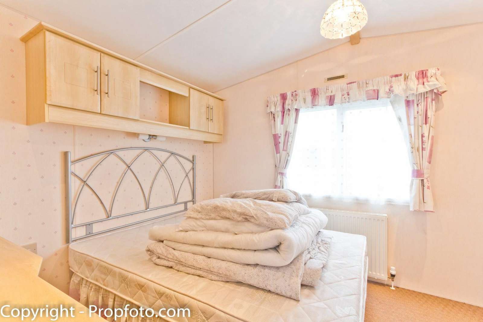You can find plenty of storage in this master bedroom