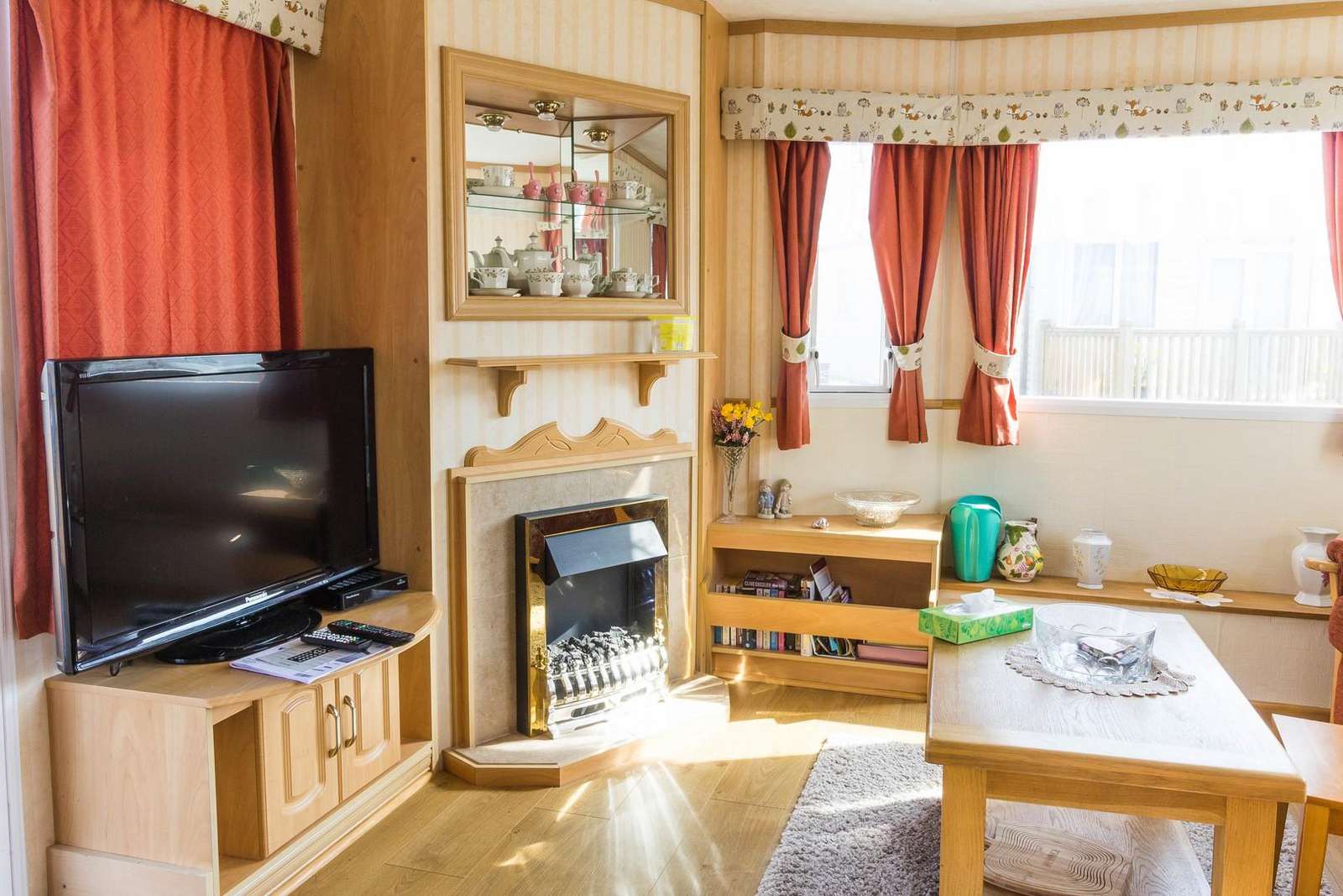 This lounge comes with a cosy electric fire and TV