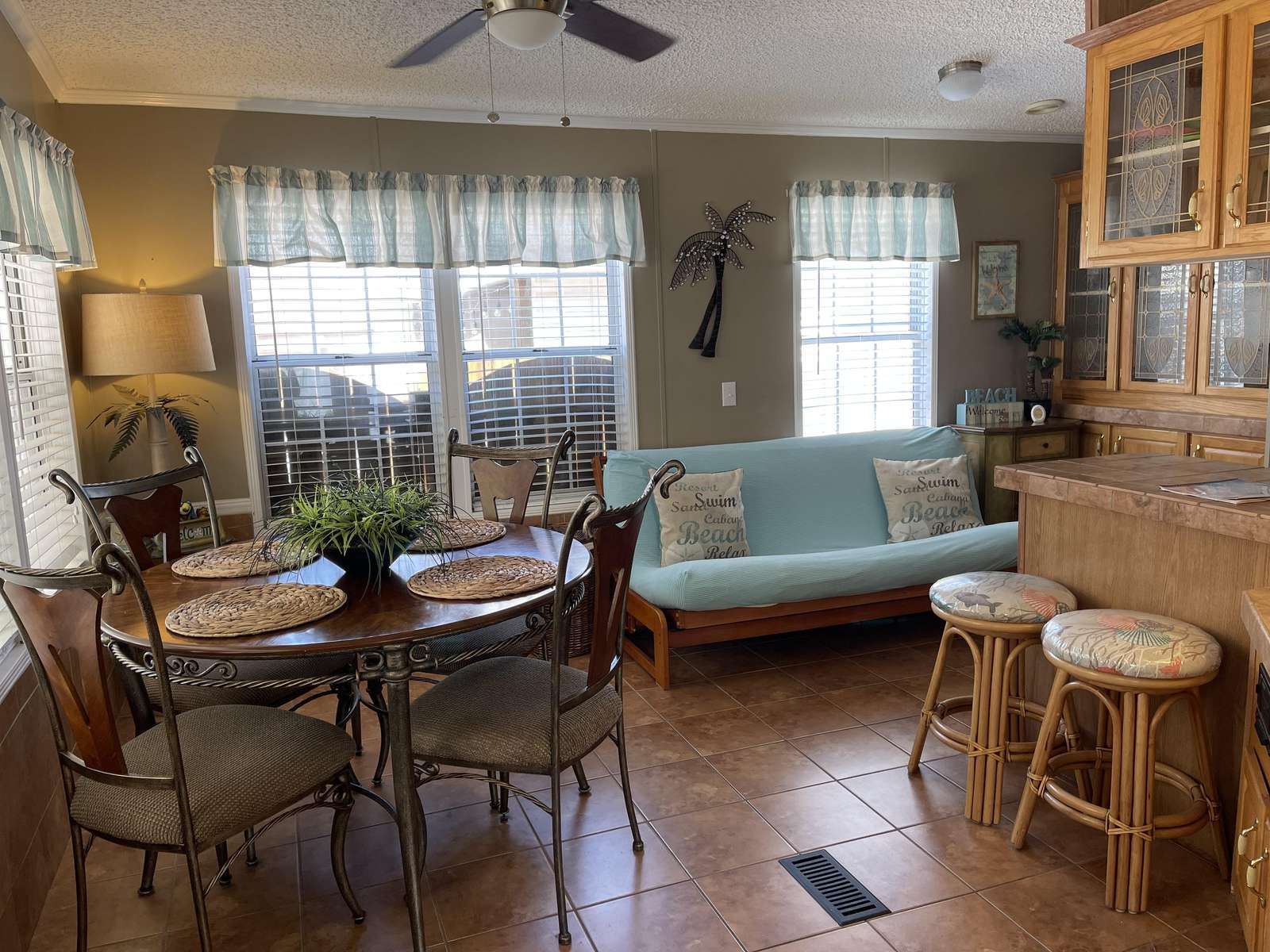 Kitchen table and bar stools at counter.