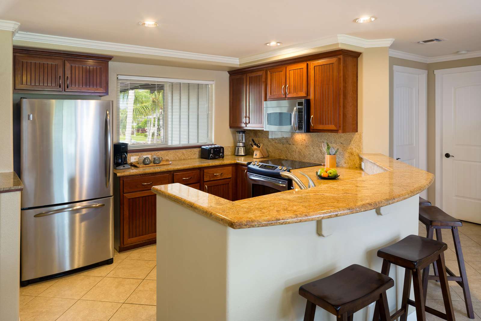 Large kitchen, stainless steel appliances, granite counter tops and hard wood cabinets