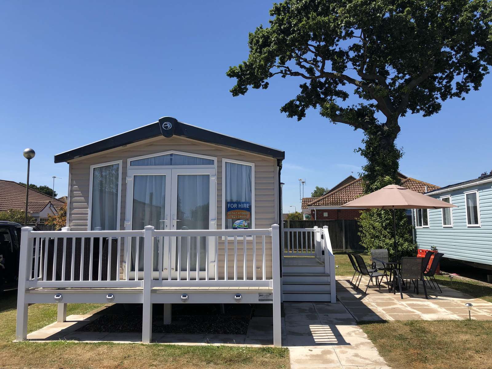 Caravan for hire with decking at Hopton Holiday Village