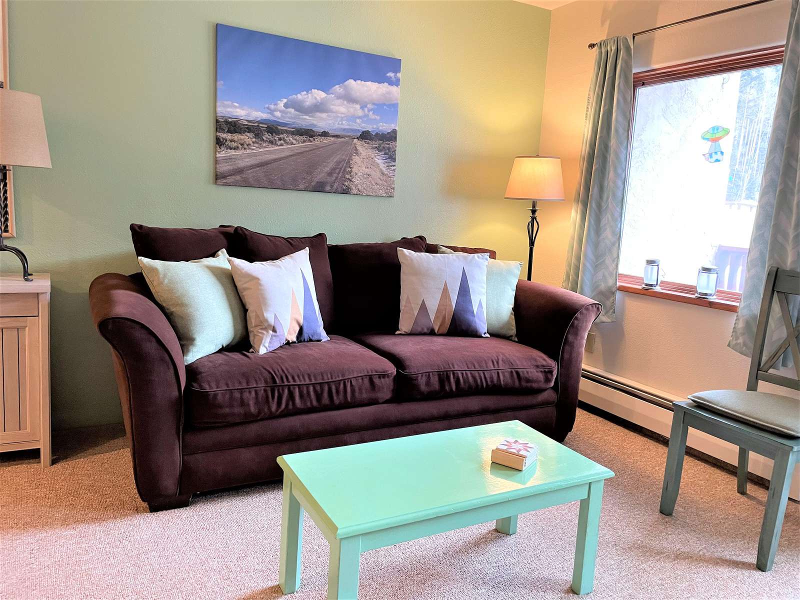 Lovely spacious living room area with queen size sofa sleeper