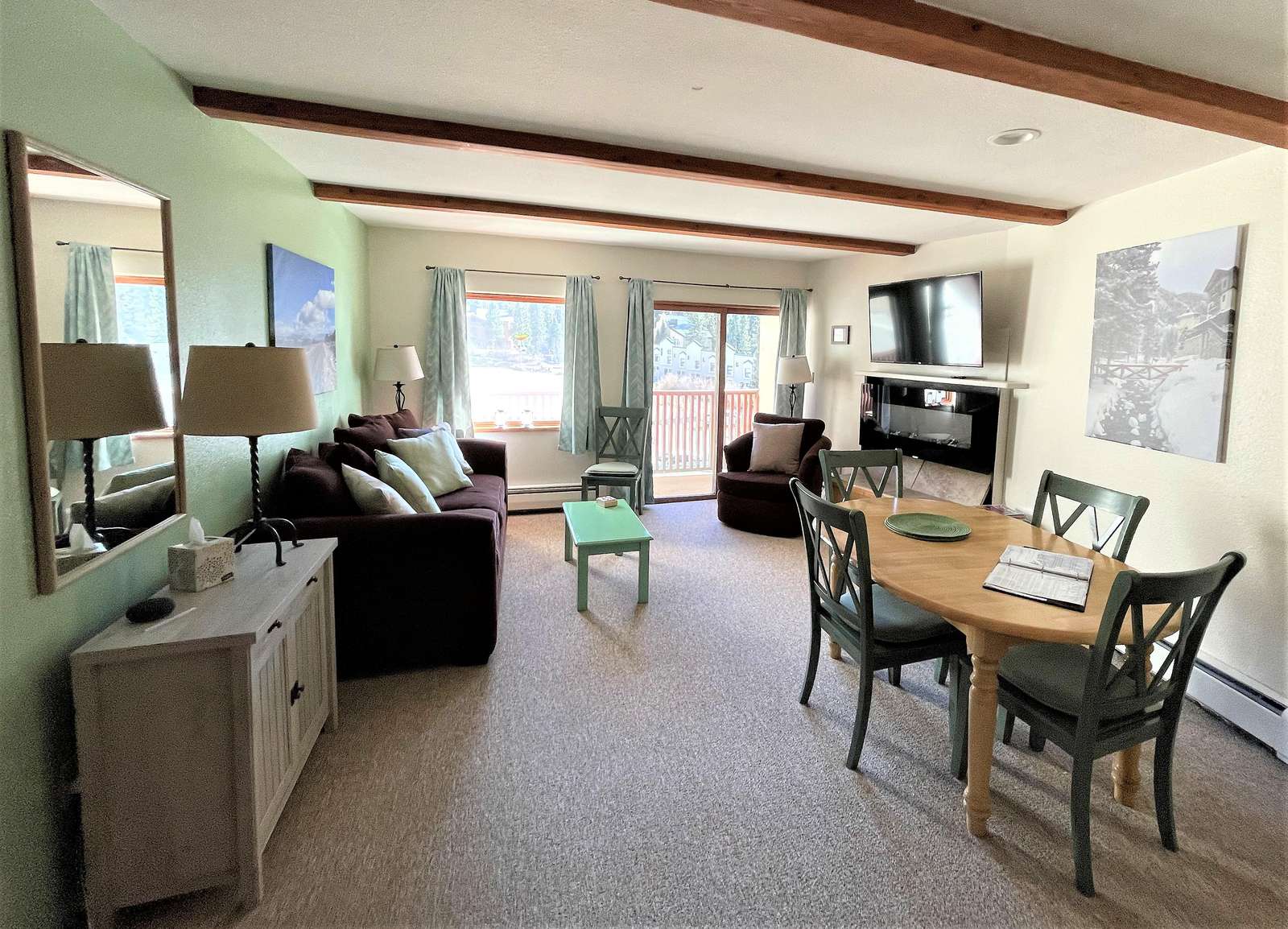 Living/Dining Room Area with Fireplace and Balcony