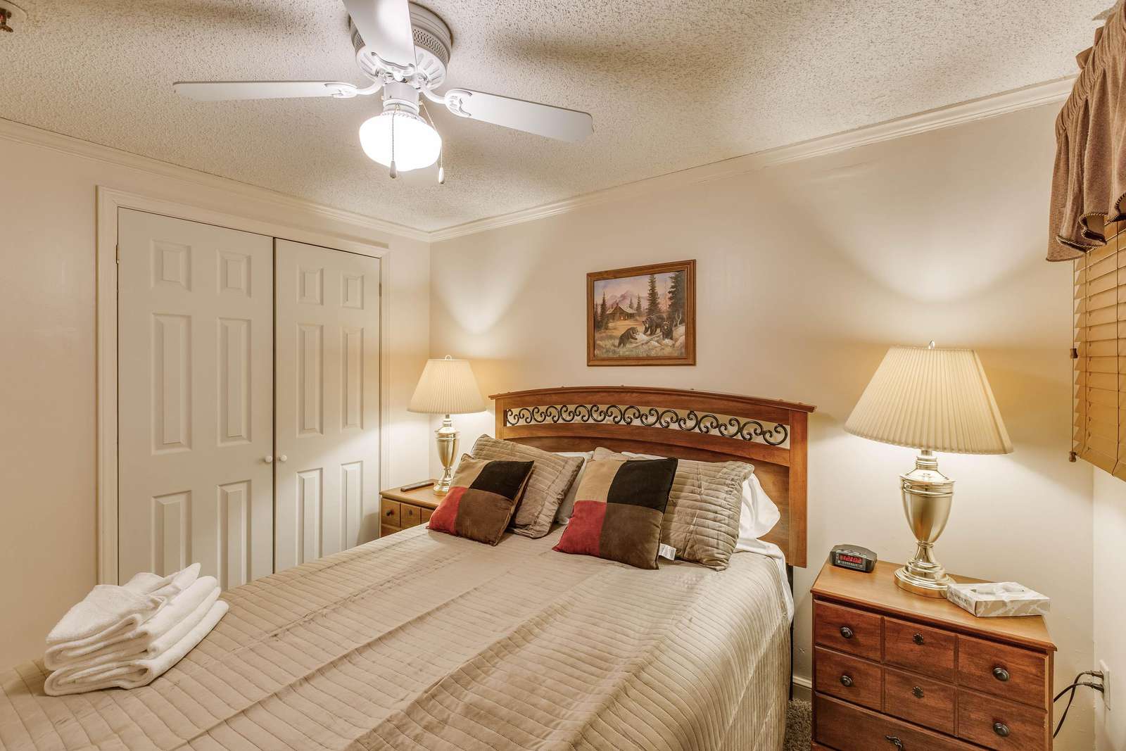 has a classy chandelier and lampshades