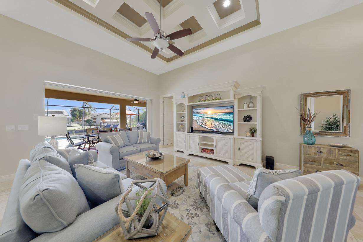 The bright and modern Living area has been decorated in cool beach themed tones - property