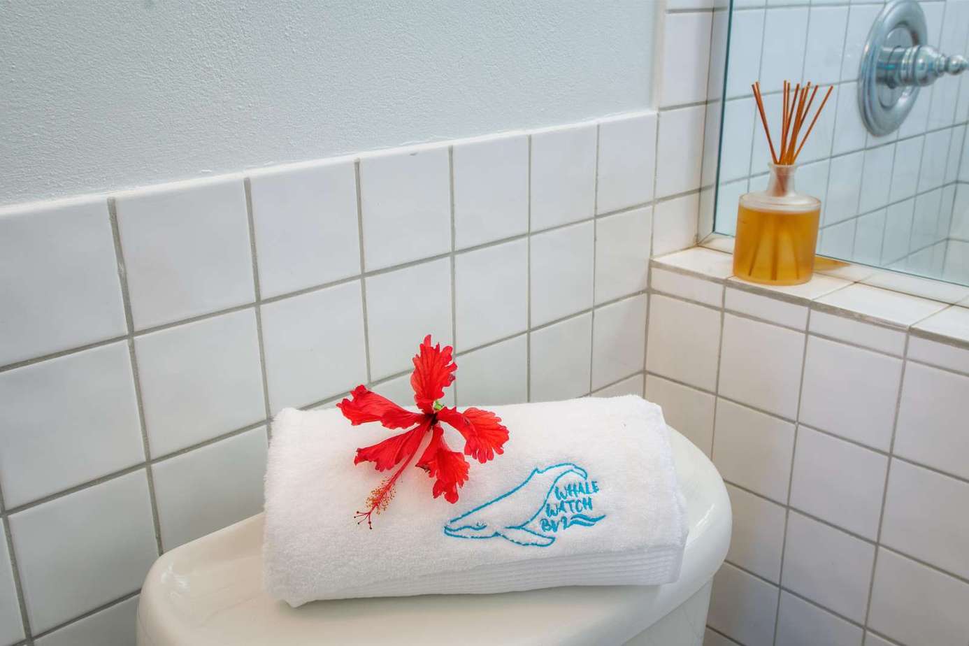 Fresh towels and serene bathroom details for your stay