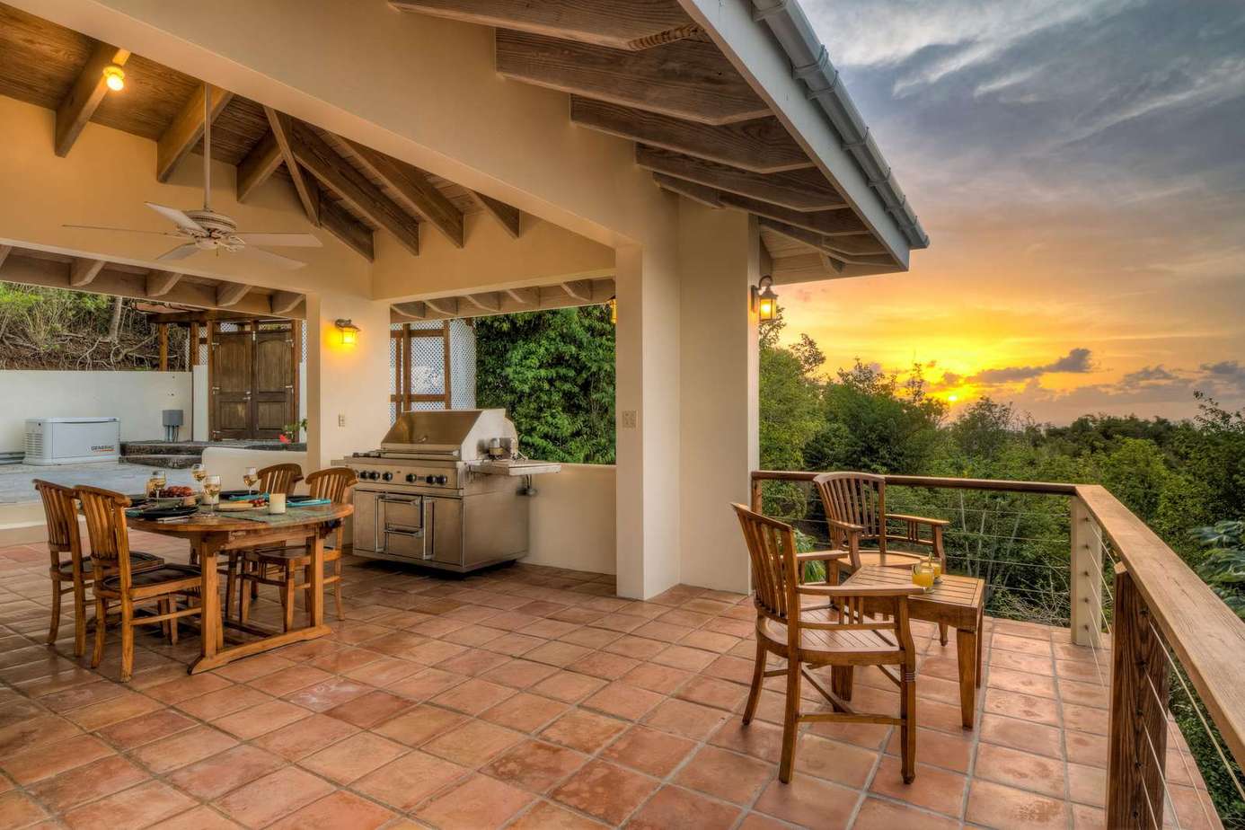 Spacious outdoor patio with sunset views and cozy seating
