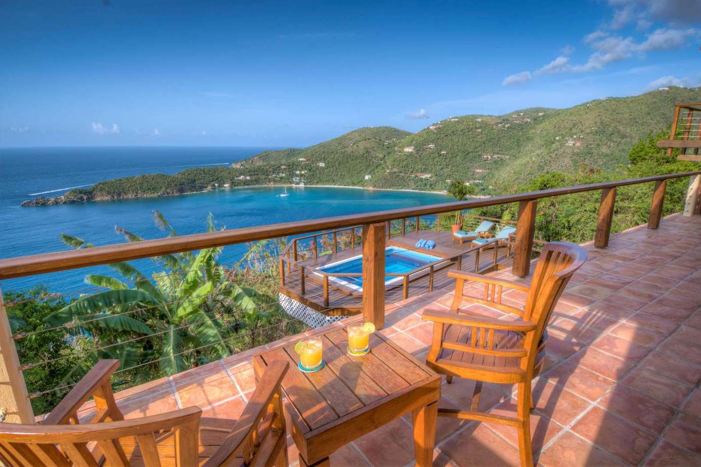 Oceanfront balcony with panoramic coastal views and tropical breeze